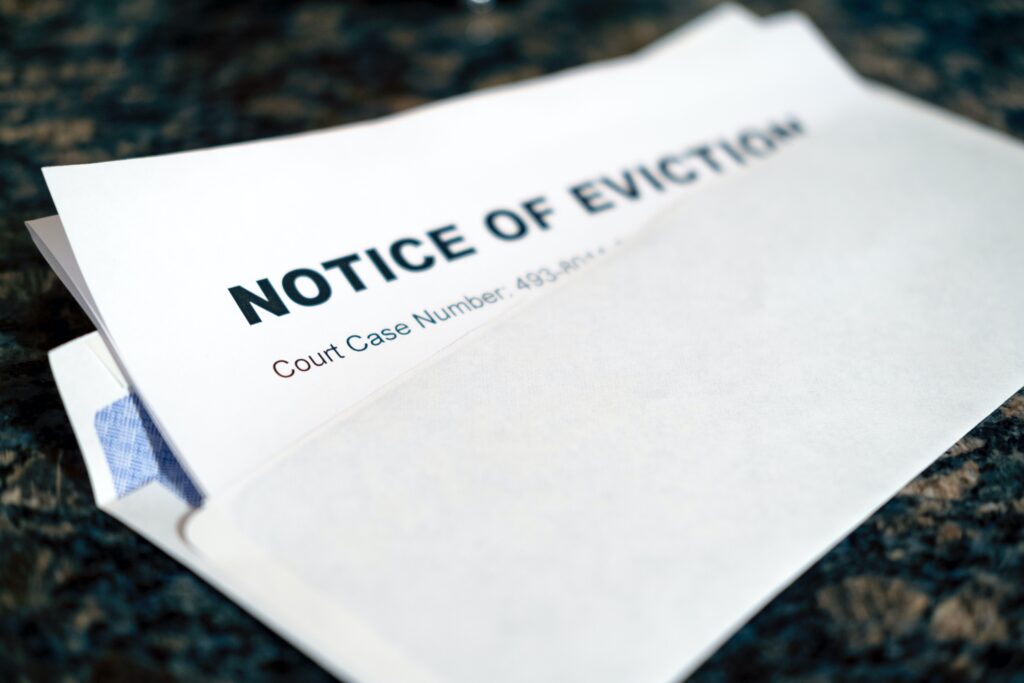 Eviction notice letter on table.